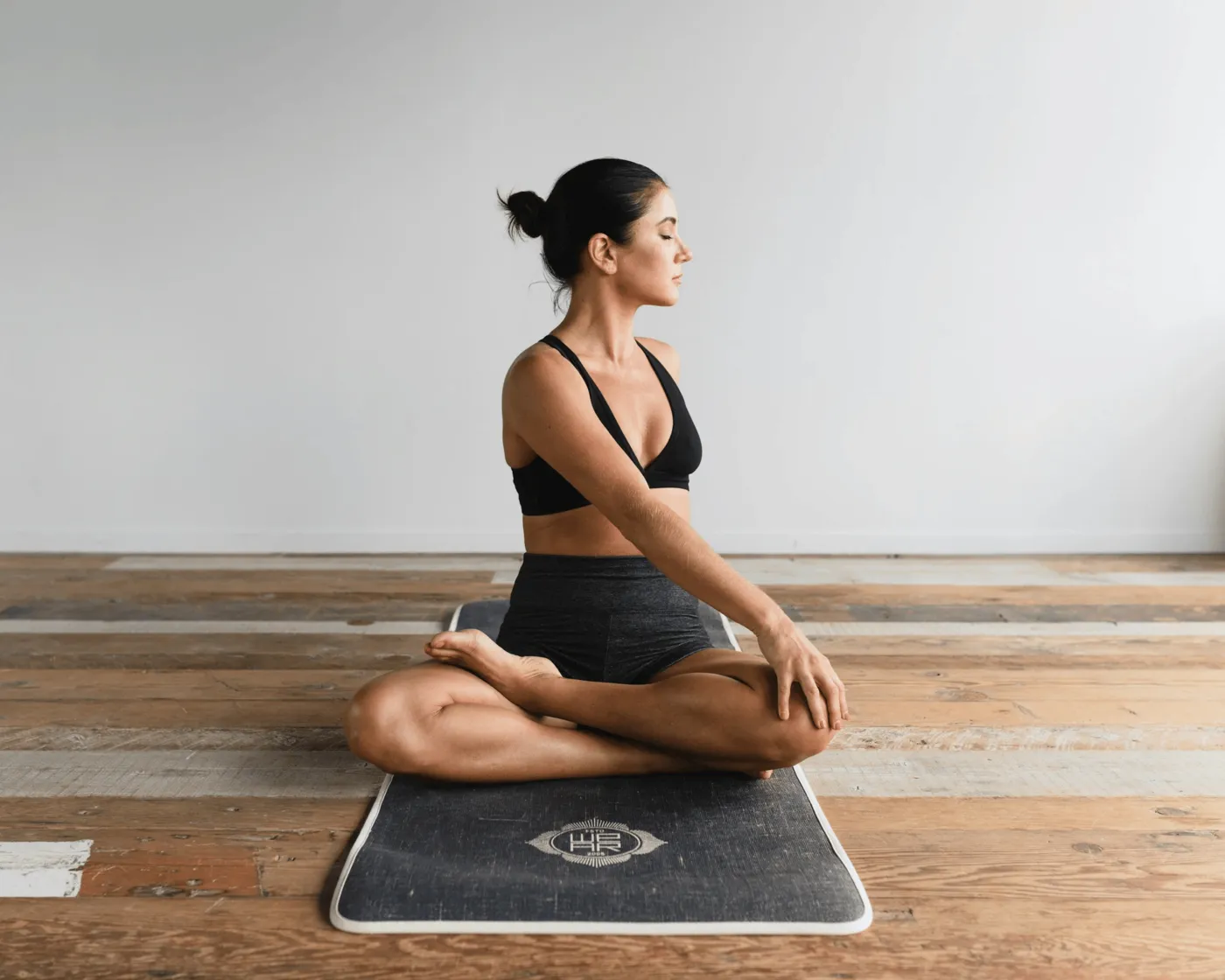 Woman practicing a seated yoga twist